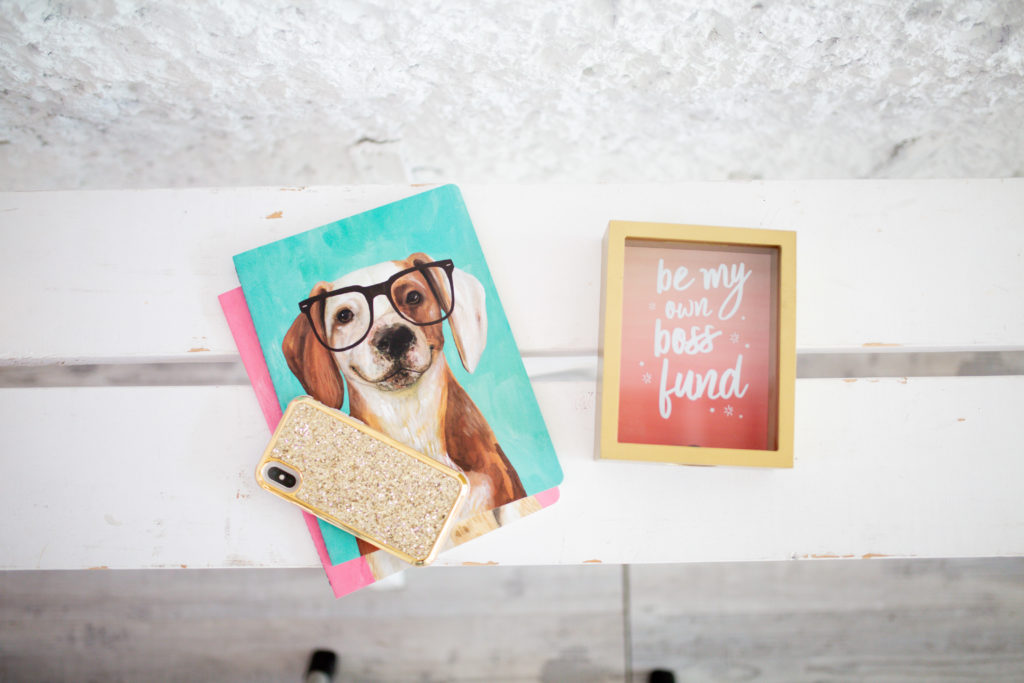 Picture of dog with phone and motivational slogan